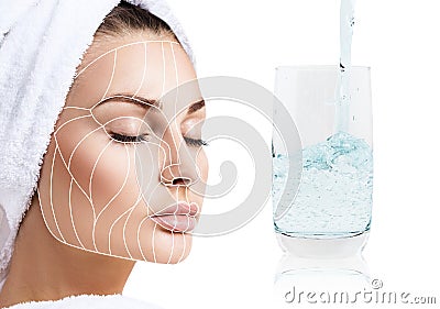 Facelift anti-aging lines on female face and glass with clear water. Stock Photo