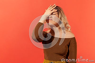 Facepalm. Portrait of woman with hand on head Stock Photo