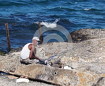 Faces Of Cuba-Fisherman Along The Malacon Editorial Stock Photo