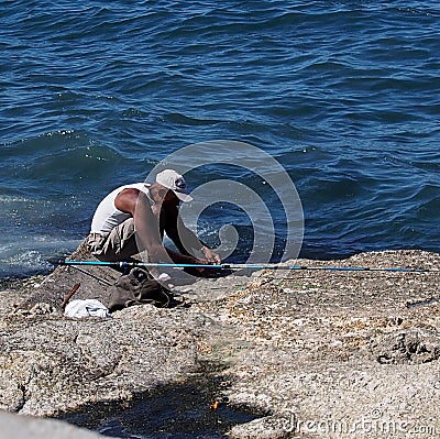 Faces Of Cuba-Fisherman Along The Malacon Editorial Stock Photo