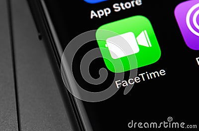 FaceTime icon app on the screen iPhone Editorial Stock Photo