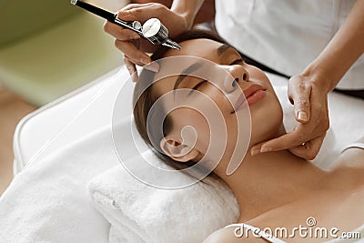 Facial Beauty Treatment. Woman Getting Oxygen Skin Peeling Stock Photo