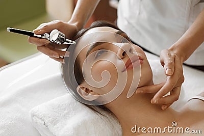 Facial Beauty Treatment. Woman Getting Oxygen Skin Peeling Stock Photo