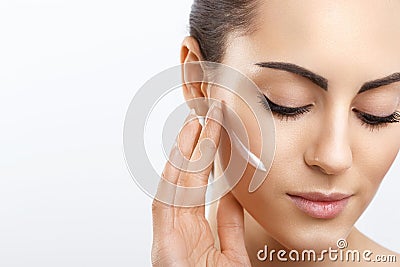 Facial Care. Female Applying Cream.Portrait Of Young Woman With Cosmetic Cream On Skin. Closeup Of Beautiful Girl With Beauty Stock Photo