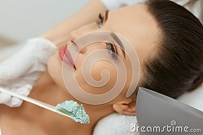 Facial Mask. Woman Applying Cosmetic Alginate Mask On Skin Stock Photo