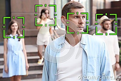 Facial recognition system identifying people on city street Stock Photo