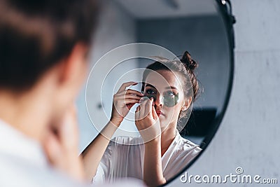 Facial skin care against wrinkles and dark circles under eyes Stock Photo