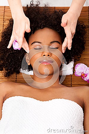 Facial temple massage in beauty spa Stock Photo