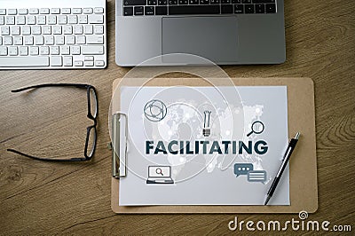 FACILITATING on table Facilitation secrets Stock Photo