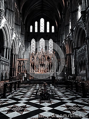 Facing the Alter with stained glass windows and great architecture Stock Photo