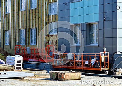 Facing of the building ventilated facade Stock Photo