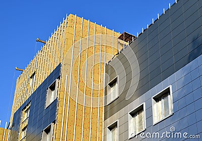 Facing of the building ventilated facade. Stock Photo