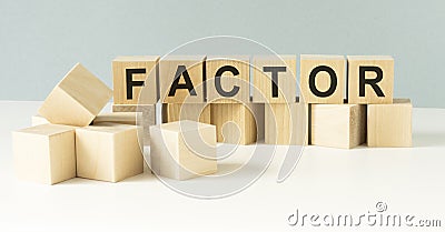 FACTOR word on blocks on a light Stock Photo