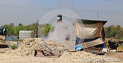 Factory boiling sugar cane. Stock Photo