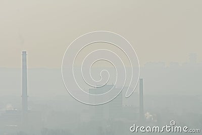 Factory and chimneys in a fog Stock Photo