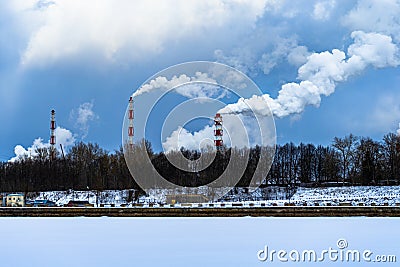 Factory chimneys with thick smoke coming out of them. smoking pipes of harmful chemical production Stock Photo