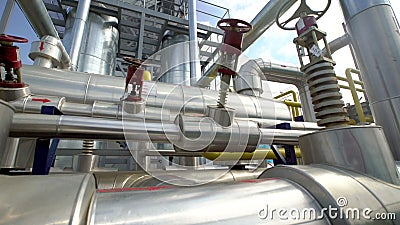 Factory distribution, and industrial processing of natural gas. Many pipelines and valves stock footage Factory distribution, and industrial processing of natural gas. Many pipelines and valves stock footage