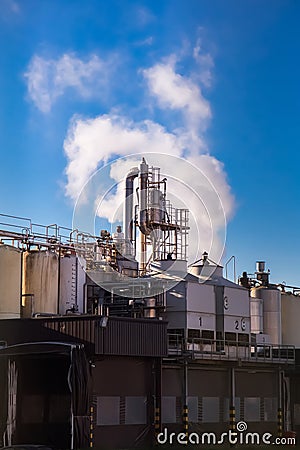 A factory emitting smoke Stock Photo