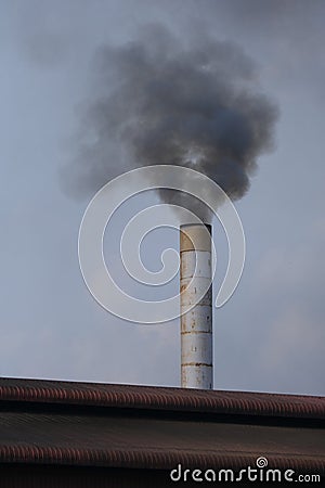 Factory flue emit smoke, pollution, industry that negatively affects the environment Stock Photo