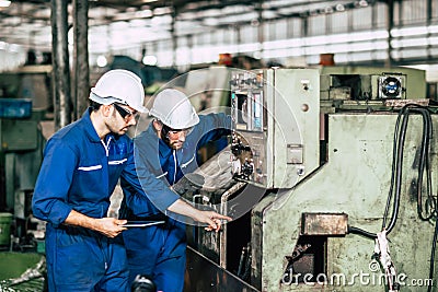 Factory machine maintenance service engineer team worker working together teamwork inspector in factory Stock Photo