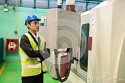 Factory manager check machine monitor console Stock Photo