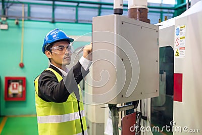 Factory manager command microchip machine in factory Stock Photo