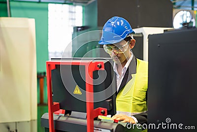 Factory manager command robot machine computer Stock Photo