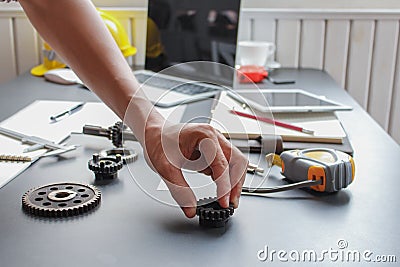 The factory mechanical engineering team is designing and developing gear sets to keep the machines running perfectly because gear Stock Photo