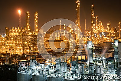 Factory of power and energy industrial at night. Petrochemical plant at twilight Stock Photo