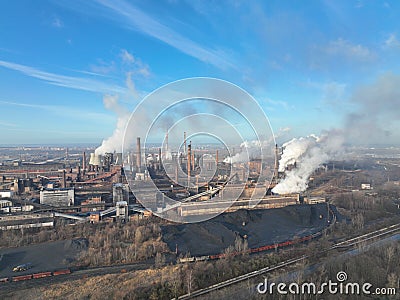 Factory metal steel processing hot, drone aerial video shot, smoke chimneys rises black poison, smog in city Ostrava Stock Photo