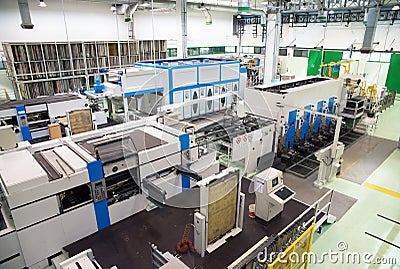 Factory - Production of cardboard foodstuff containers Stock Photo