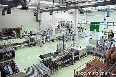 Factory - Production of cardboard foodstuff containers Stock Photo