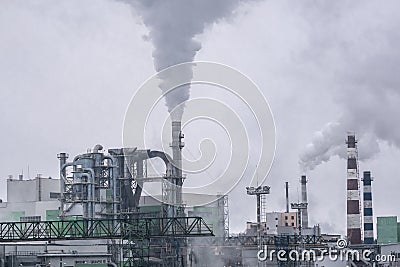 The factory releases a lot of smoke and smog into the sky Stock Photo