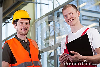 Factory workers and the project manager Stock Photo