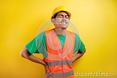 Factory workers tired and inflame back muscle from hard work Stock Photo