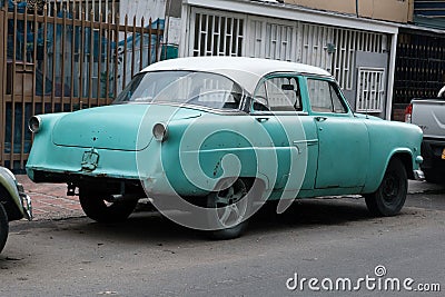 Faded Glory: Vintage North American Classic Car in Turquoise and White, Weathered but Timeless Stock Photo