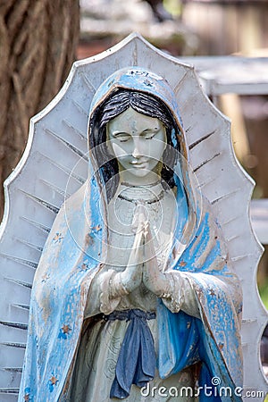 statue of the virgin Mary praying Stock Photo