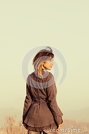 Faded portrait of woman looking over shoulder Stock Photo