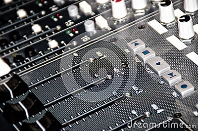 Faders and buttons on a mixing board Stock Photo