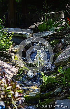 Faerie in a stream Stock Photo