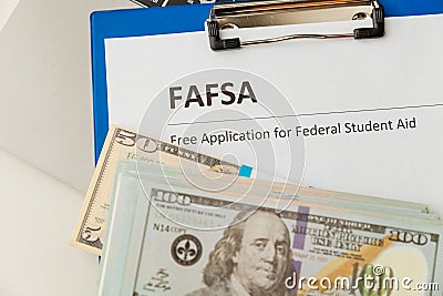 Fafsa. Student aid. Money on the table. Stock Photo