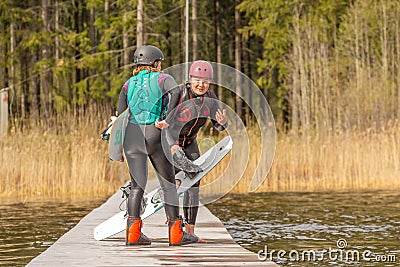 Fagersta, Sweden - Maj 07, 2020: Girls teenagers wakeboarding discuss a failed jump Editorial Stock Photo