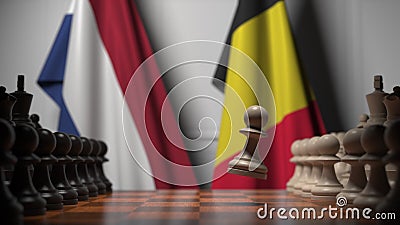 Fahnen aus den Niederlanden und Belgien hinter den Pferden auf dem Schachbrett Schachspiel oder politische Rivalität im Zusammenh stock video Fahnen aus den Niederlanden und Belgien hinter den Pferden auf dem Schachbrett Schachspiel oder politische Rivalität im Zusammenh stock video