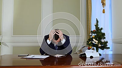 Failed businessman losing money before Christmas Stock Photo
