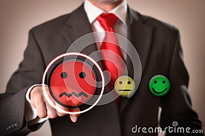 Failure concept with businessman pointing out sad emoticon Stock Photo