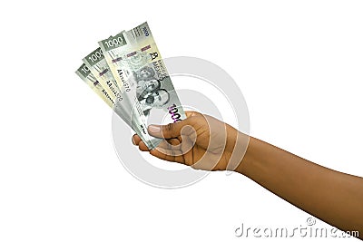 Fair hand holding Mexican Peso notes isolated on white background Stock Photo