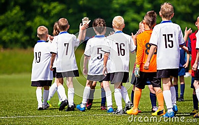 Fair Play Rules in Youth Football. Happy Football Players Giving High Five At Field. Soccer Players High Five After Game Editorial Stock Photo