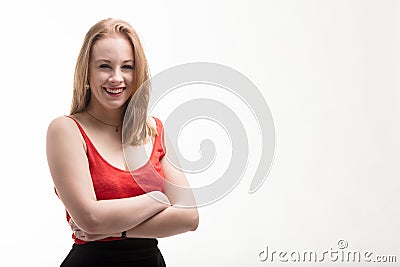 Fair-skinned woman in red dress laughs Stock Photo