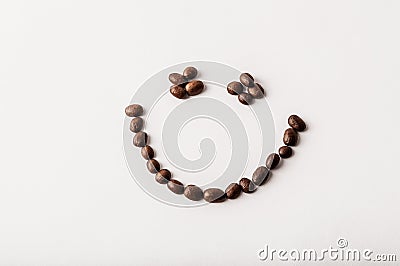 Fair trade roasted organic coffee beans arranged as a smile on w Stock Photo