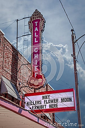 Fairfax OK USA - Retro neon Tall Chief Movie sign over marquee reading Why Killers Flower Moon Exhibit Here in town Editorial Stock Photo